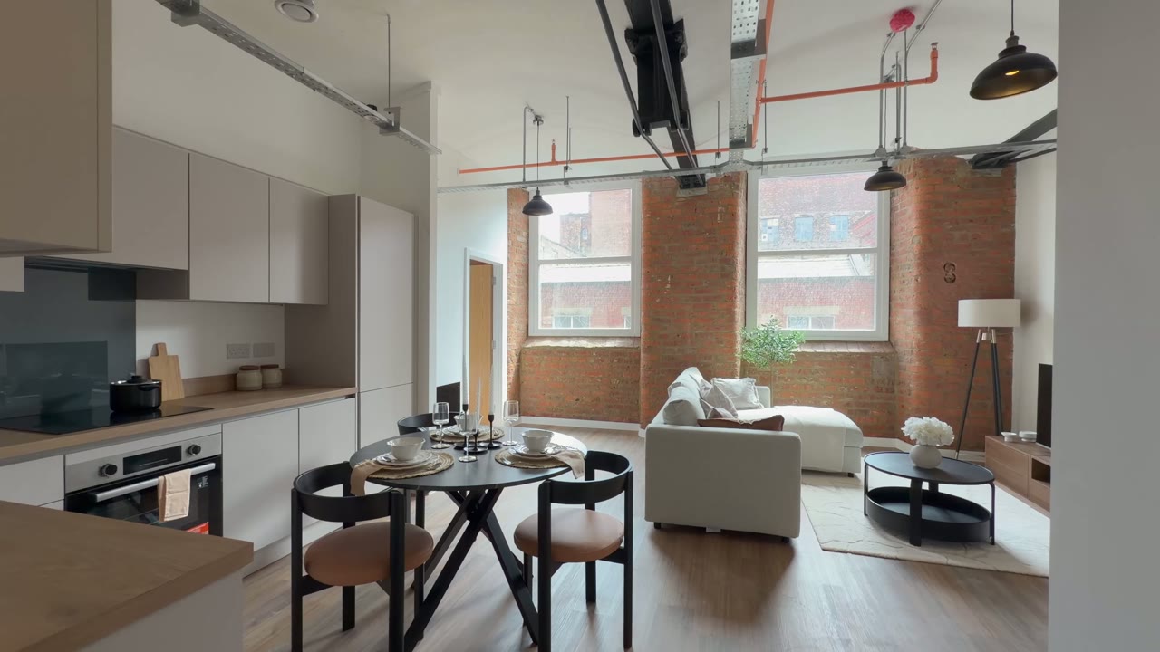 Brunswick Mill show apartment — living space with exposed brickwork
