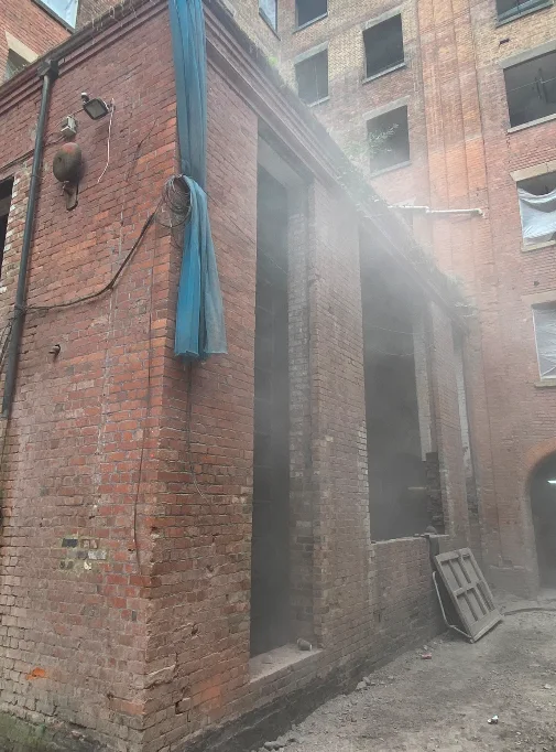 Sandblasting the main concierge building façade brickwork at Brunswick Mill