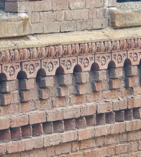 Original decorative corbel brickwork on the Brunswick Mill façade, cleaned and maintained