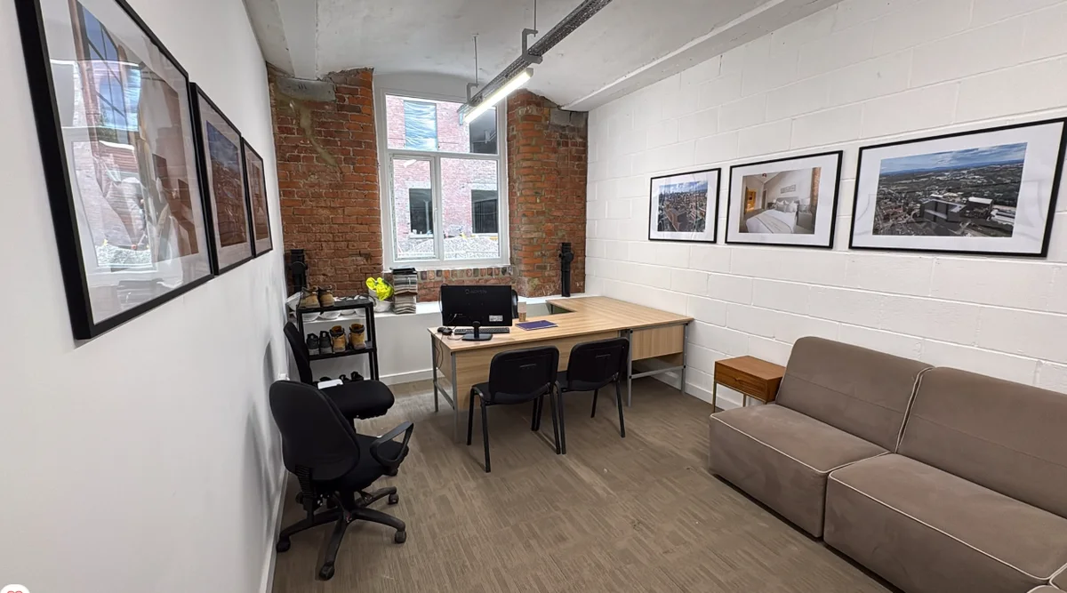 The new site and sales team offices at Brunswick Mill, with exposed brickwork and framed photography