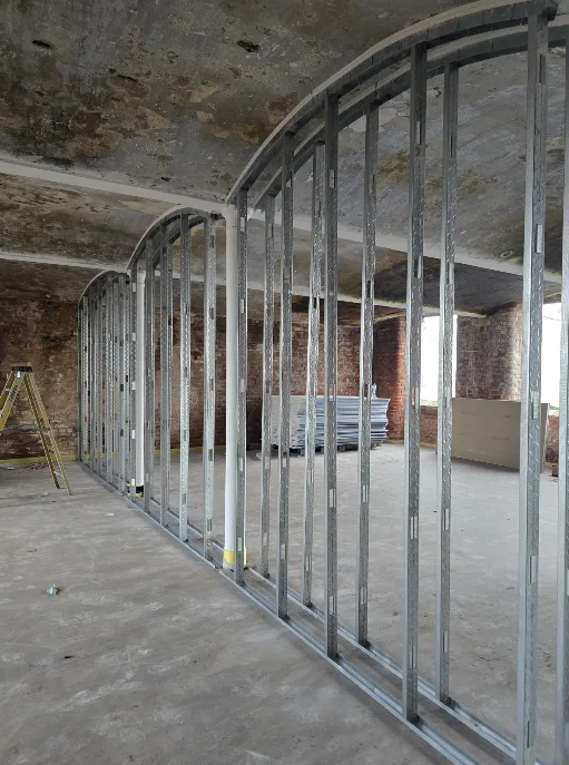 Dry lining framing to the curved ceiling of the old Mill Engine House apartments at Brunswick Mill