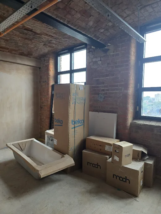 Appliances and sanitaryware being loaded out into 3rd floor apartments at Brunswick Mill